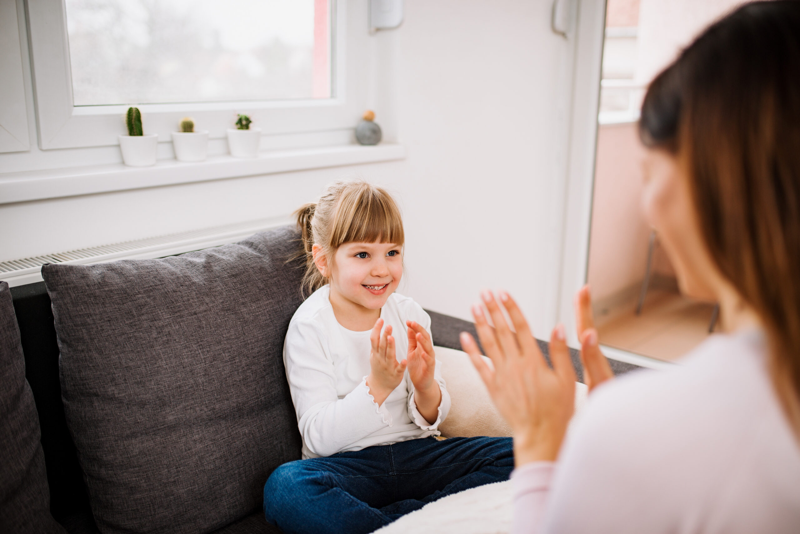 Cute little girl playing with her mother indoors. Discover how Occupational Therapy helps people with ADHD manage focus, routines and emotions. Discover Bloom Healthcare's expert, NDIS-supported care services